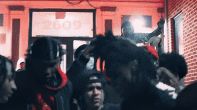 Crowd In Front Of Building Number 2609 GIF