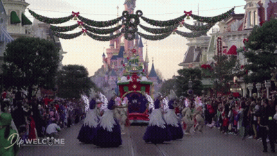 Crowd In Front Of Castle And Do Welcome Sign GIF