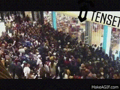 Crowd In Mall Under Tense Sign GIF