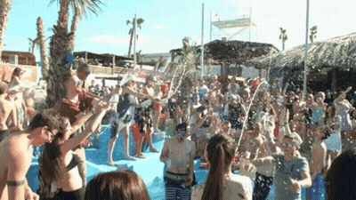 Crowd In Pool With Water Bottles Pouring GIF