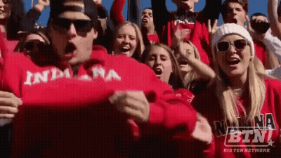 Crowd In Red Indiana Sweatshirts Cheering GIF
