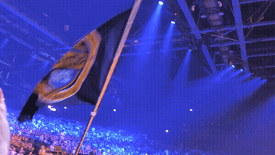 Crowd In Stadium With Flag Saying A GIF