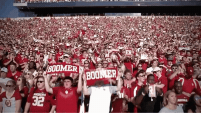 Crowd In Stadium With Sooner Banners GIF