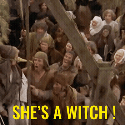 Crowd Of People With She's A Witch Text GIF
