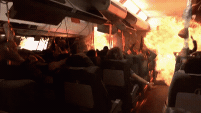 Crowd On Plane With Flames From Ceiling GIF