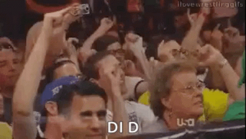 Crowd Raising Hands Watching Wrestling Match GIF