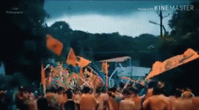 Crowd Standing In Front Of Stage At Carnival GIF
