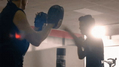Crowd Standing With Arms In The Air GIF