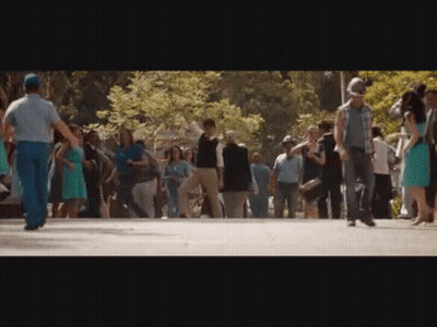 Crowd Walking Down Park Street GIF