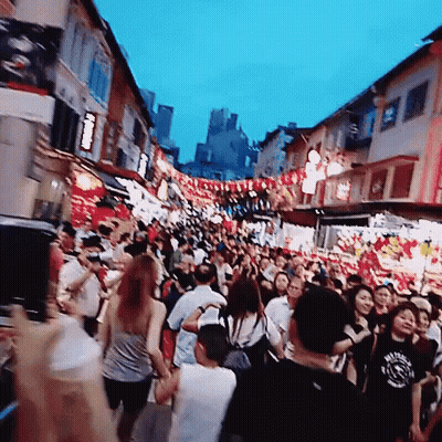 Crowd Walking Down Street With Man In Sydney T-Shirt GIF