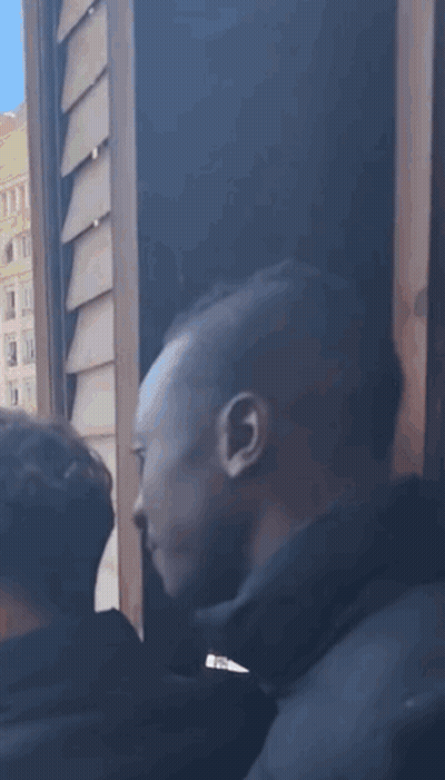 Crowd Watching Football Game As Santa Takes Picture GIF