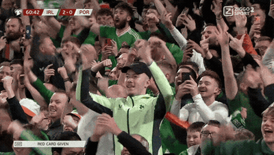 Crowd Watching Soccer Scoreboard Ireland 2-0 Por GIF