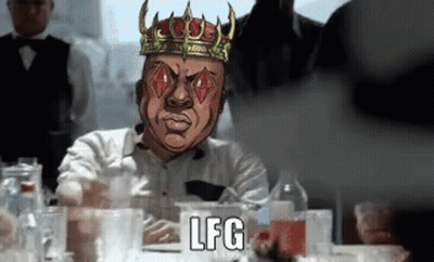 Crowned Man Playing Cards At Table With Glasses GIF