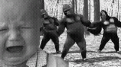Crying Baby With Dancing Gorillas In Woods GIF