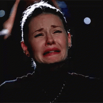 Crying Woman Eating Sandwich With Eyes Closed GIF