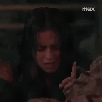 Crying Woman Holding Bricks In Dark Room GIF