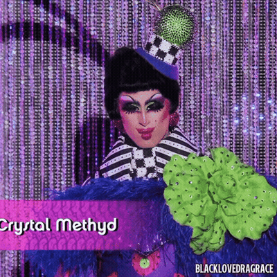 Crystal Methyd Drag Queen In Striped Outfit And Top Hat GIF