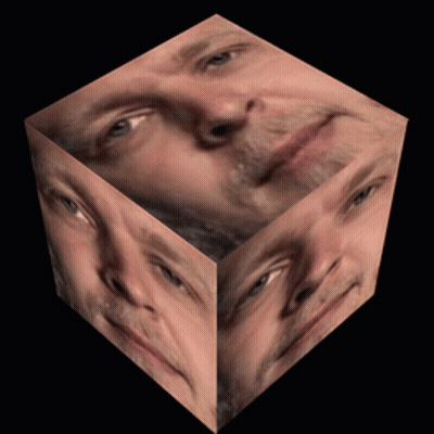 Cube With Man's Face On Black Background GIF