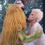 Cuca Kissing Old Woman