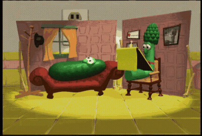 Cucumber Sitting On Couch And Asparagus Reading Book GIF