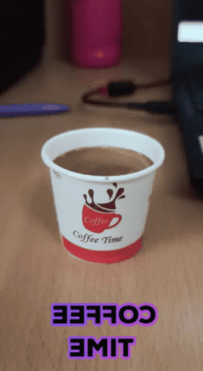 Cup Of Coffee On Wooden Table GIF