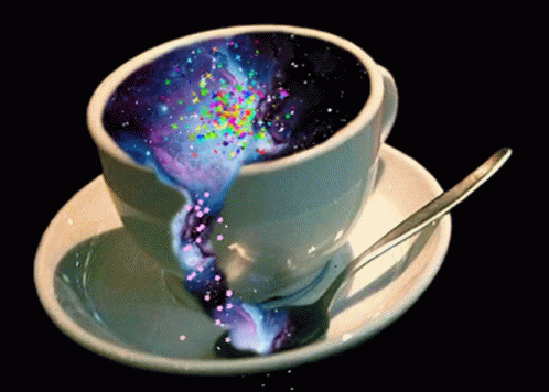 Cup Of Coffee With Galaxy Inside And Saucer With Spoon GIF