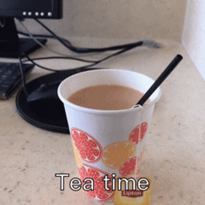 Cup Of Lipton Tea Next To Computer Monitor GIF