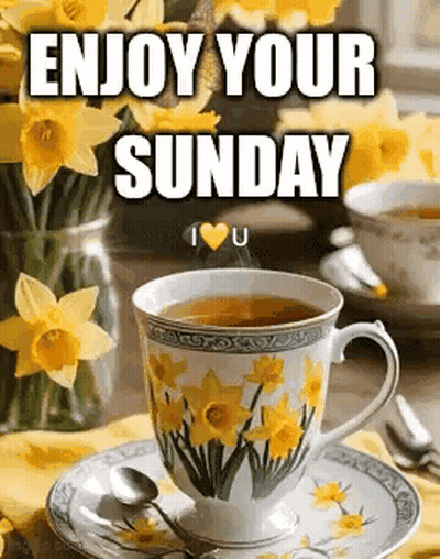 Cup Of Tea Next To Yellow Flowers GIF