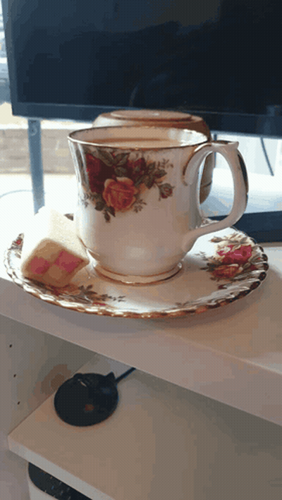 Cup With Roses On Saucer GIF