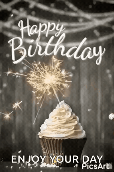Cupcake With Whipped Cream And Sparklers GIF