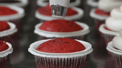 Cupcakes Decorated With Red Frosting And Icing GIF