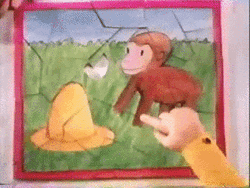 Curious George Pointing At Missing Puzzle Piece GIF