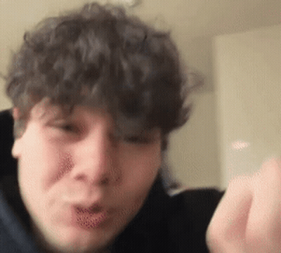 Curly Hair Man Making Funny Face With Hand GIF