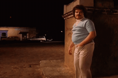 Curly Hair Mustache Man Leaning On Brick Wall Night GIF