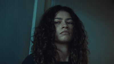 Curly Hair Woman Serious Look At Camera GIF