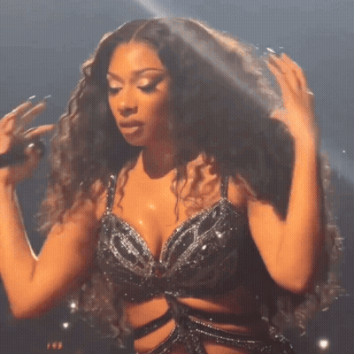 Curly Hair Woman Singing Into Microphone Black Bra GIF