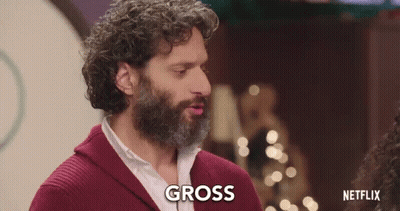 Curly Haired Bearded Man Saying Gross To Woman GIF