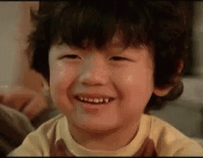 Curly-Haired Boy Smiling Eyes Closed GIF