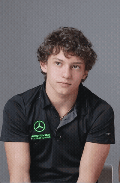 Curly Haired Man In Black AMG Shirt GIF