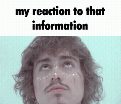 Curly Haired Man With Mustache Saying My Reaction To That Information GIF