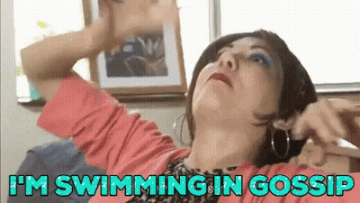 Curly-Haired Woman Arms Outstretched Before Carriage GIF