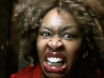 Curly-Haired Woman Making Angry Face GIF