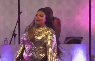 Curly Haired Woman Pink Jacket Making Funny Face GIF