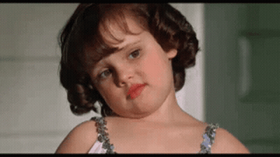Curly Little Girl Making Funny Face In Bra GIF