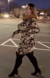 Curvy Woman Modeling Winter Clothes GIF