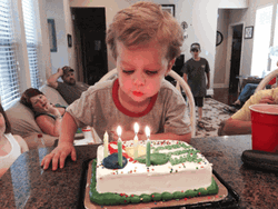 Cute Baby Blowing Cake GIF