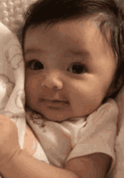 Cute Baby Lying Shy Smile GIF