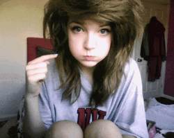 Cute Girl Mimicking Pimple Popping Action GIF