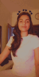 Cute Girl Smiles With Black Hearts GIF