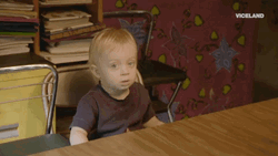 Cute Kid Sitting Blank Stare GIF